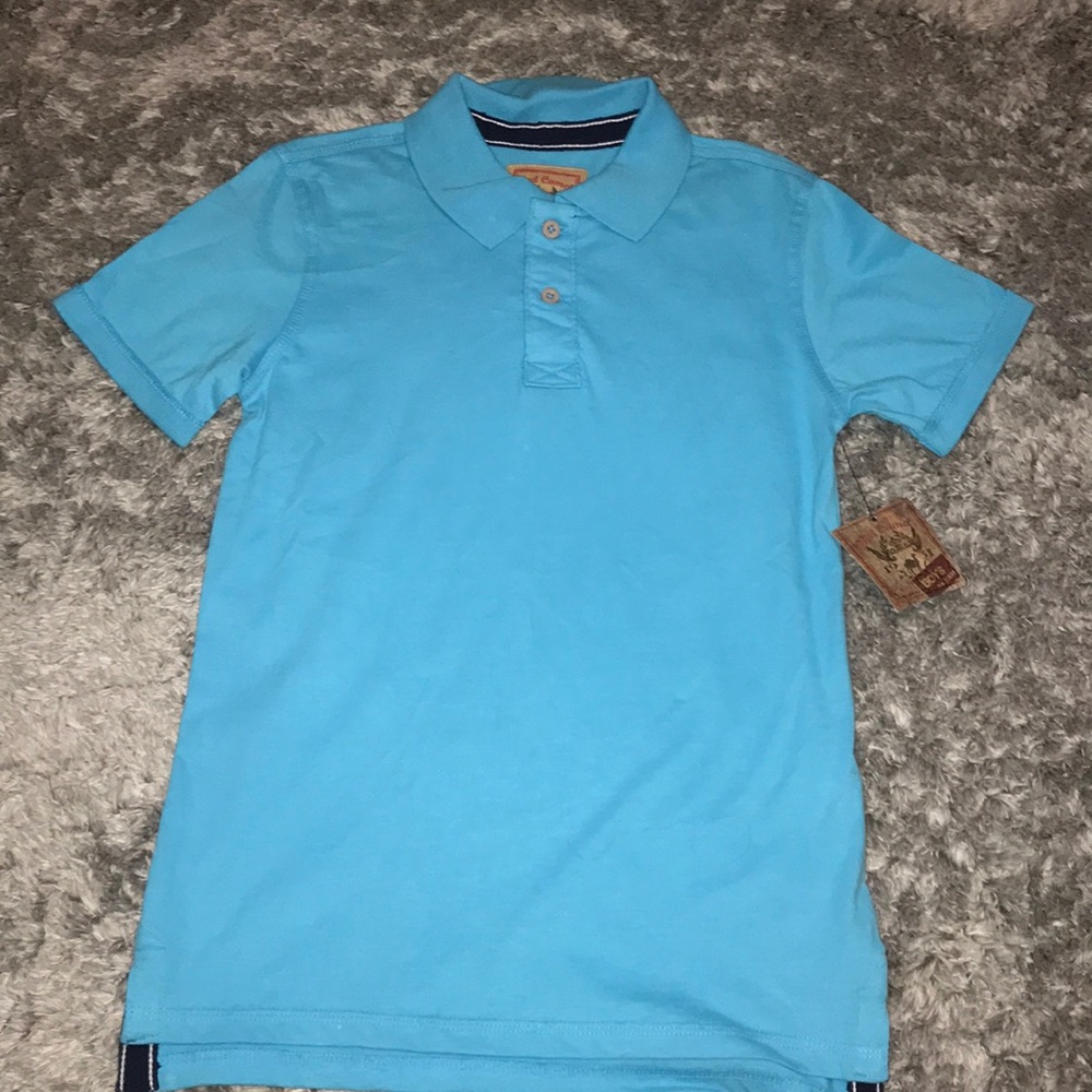 A little boys button up blue shirt.